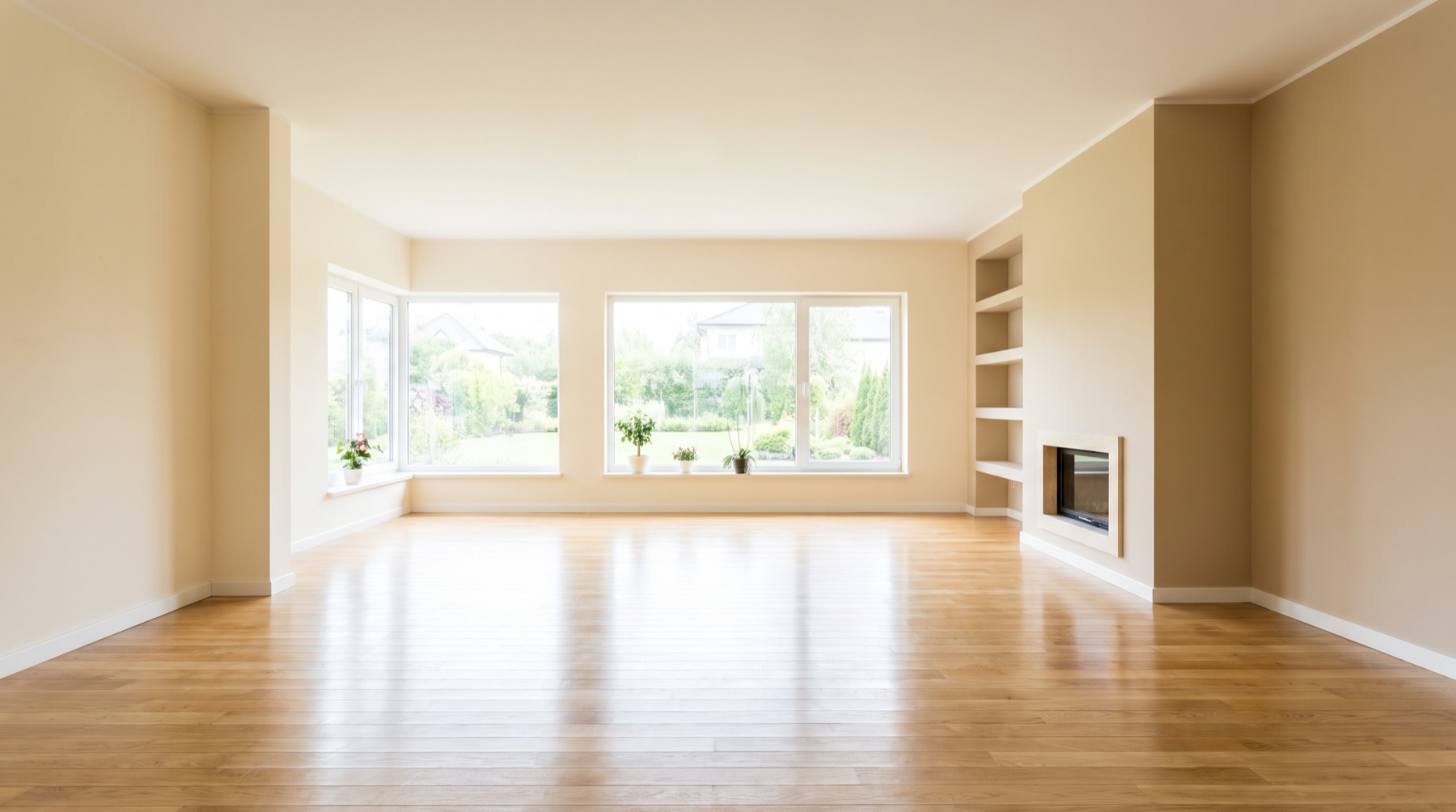 A bright, freshly cleaned, move-in-ready living room with gleaming floors
